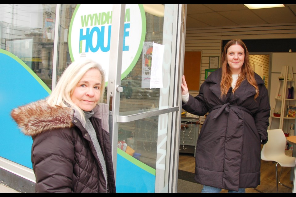 Executive director Debbie Bentley-Lauzon, left, and program director Kristen Cairney hold open the door to Wyndham House's Concurrent Specialized Youth Hub on Woolwich Street.