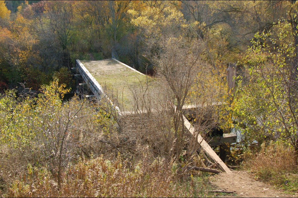 Infrastructure Ontario has begun the process to demolish an historic wooden bridge on the former Guelph reformatory lands.