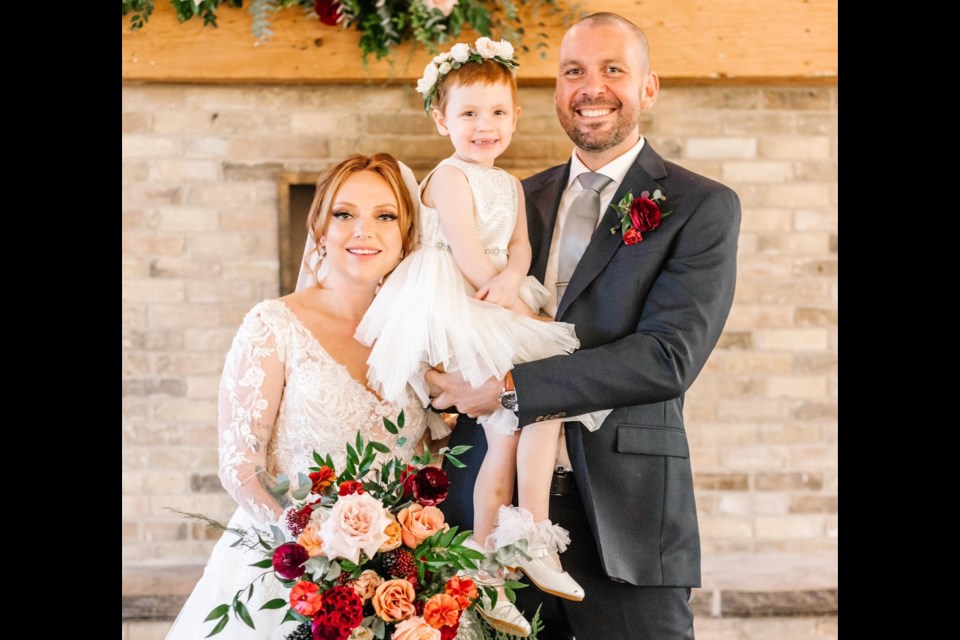 Sarah Dovick, Autumn Nichols and Karl Dovick at their wedding on Dec. 4, 2022.