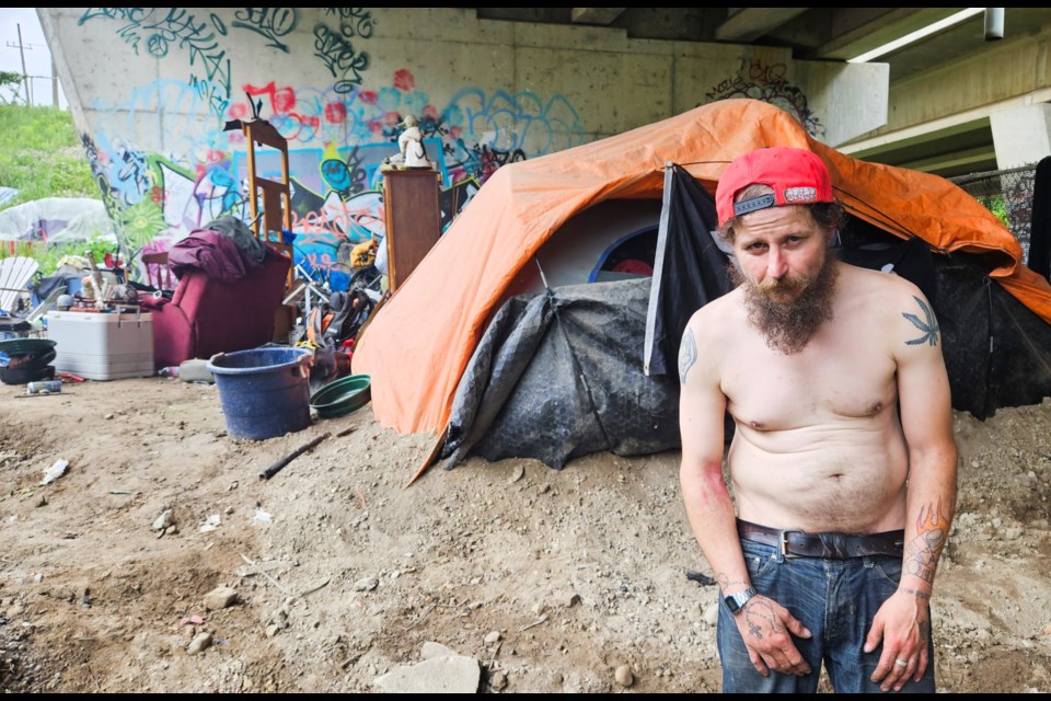 David Dobbs has lived in an encampment below the Hanlon Expressway bridge over the Speed River for about a year.