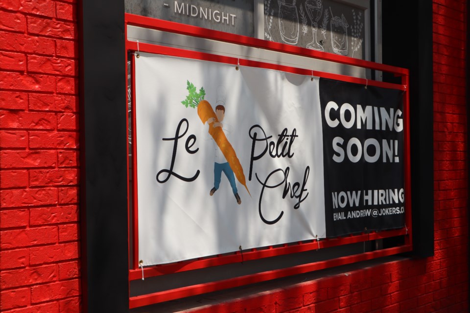 A coming soon sign for Le Petit Chef.