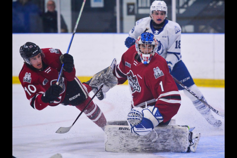 Jake Karabela goes down in front of Guelph Storm teammate Damian Slavic during pre-season action in Mississauga Friday.
