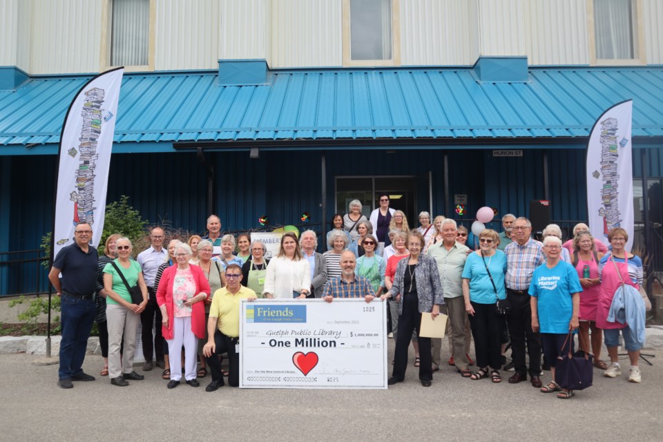 Community members, volunteers, members of the Guelph Public Library and Friends of the Guelph Public Library with the $1 million cheque.