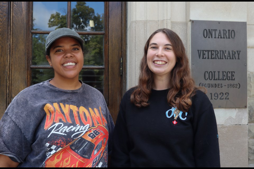 Keisha Harris and Sandra Nyman outside the Ontario Veterinary College building at the University of Guelph.