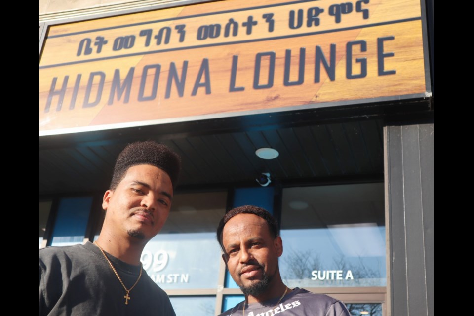 Hidmona Lounge co-owners Matiwos Gaim and Kudus Hailemichael outside their restaurant on 99 Wyndham St.