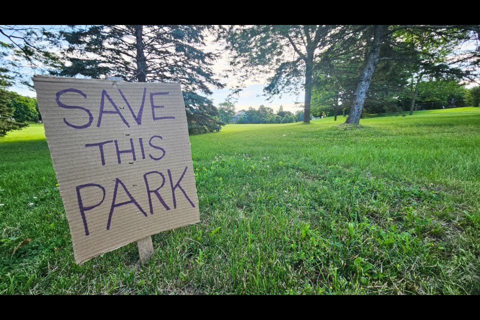 This sign was put up in Hugh C. Guthrie Park, facing Edinburgh Road, which is one of the sites identified by city staff for potential use for an affordable housing project.