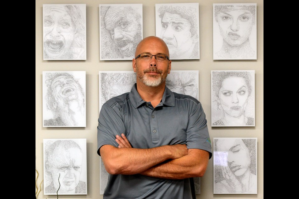 Mike Salisbury, artist and city councillor, stands with his work How Are You Feeling Today? Tuesday, Aug. 1, 2017. Tony Saxon/GuelphToday