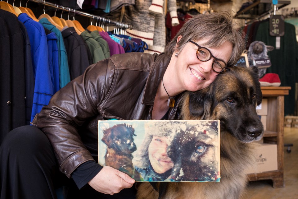Julianna Murphy and her PTSD service dog Char seen at the opening of her show Saturday at Persephone's Wardrobe on Wilson St. Kenneth Armstrong/GuelphToday