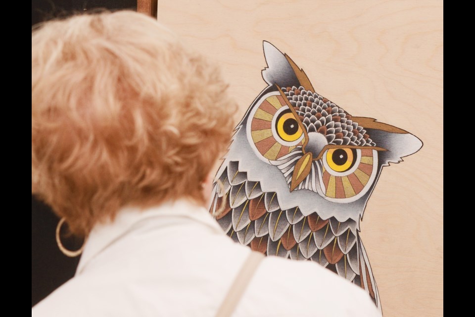 Adam Honsinger's Owl art keeps an eye on an interested party at Saturday's Art on the Street in Downtown Guelph that runs until 5 p.m. Tony Saxon/GuelphToday