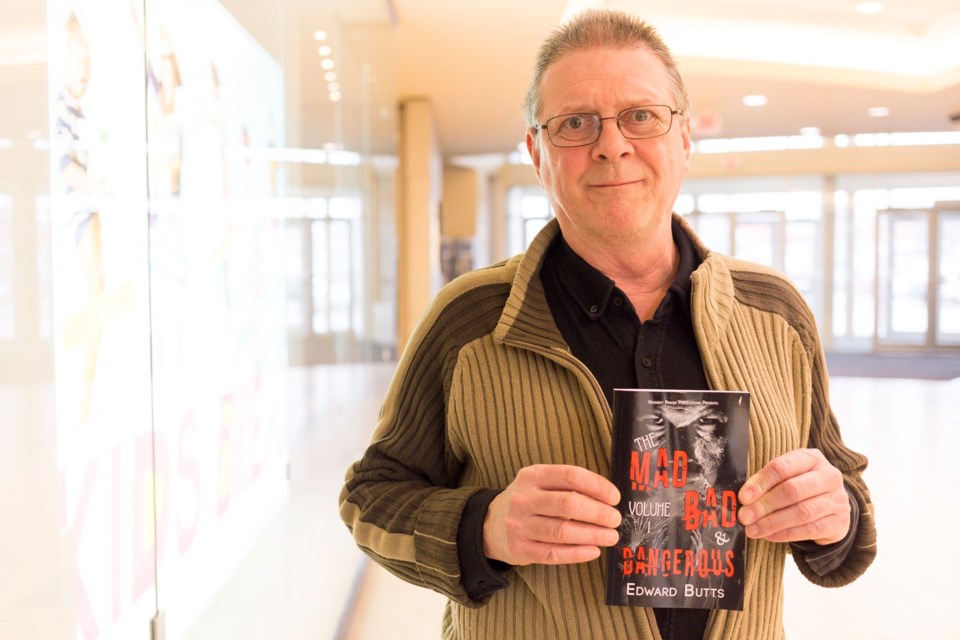 Author Ed Butts poses with a copy of his newest book. Kenneth Armstrong/GuelphToday