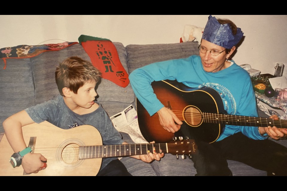 John Tonin (right) plays guitar with his son Jake in this undated photo. Jake will perform at John's tribute show Sept. 30 at Royal City Studios.