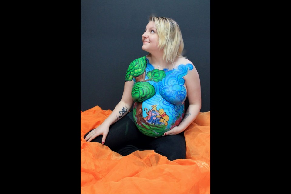 Tania Crook used this pregnant model for her painting. Photo courtesy of Infinite Body Arts.  