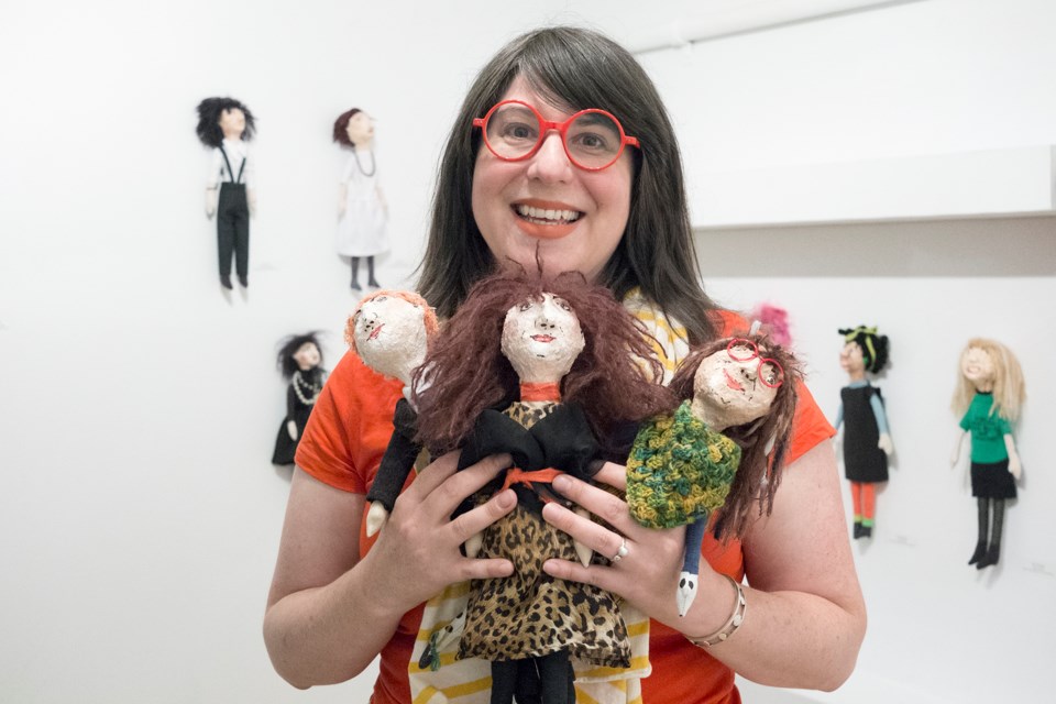 Alisa McRonald poses in Capacity 3 Gallery with dolls from her Ladystar series. The exhibit runs until Oct. 9. Kenneth Armstrong/GuelphToday