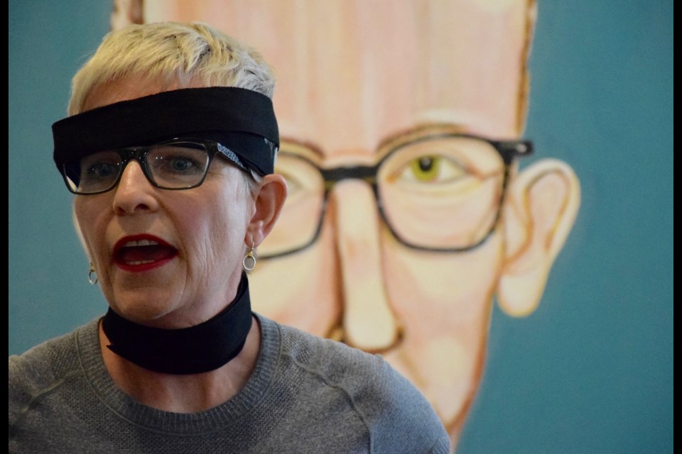 Artist Maureen Ellis performance at the opening of Artful Aging spoke directly about the meaning and consequences of her own aging. Rob O'Flanagan/GuelphToday