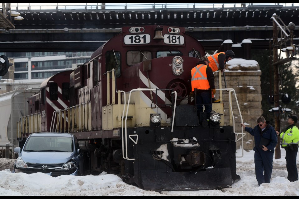 Police say no one was injured when a Guelph Junction Railway train hit a small car on the tracks at the Macdonell Street/Woolwich Street intersection Tuesday, Dec. 20, 2016. Tony Saxon/GuelphToday