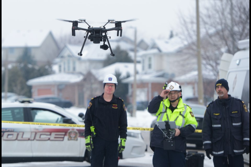 Investigators from the Ontario Fire Marshall's Office launch a drone Saturday morning to take video footage of the house that exploded in south Guelph on Friday afternoon. Tony Saxon/GuelphToday