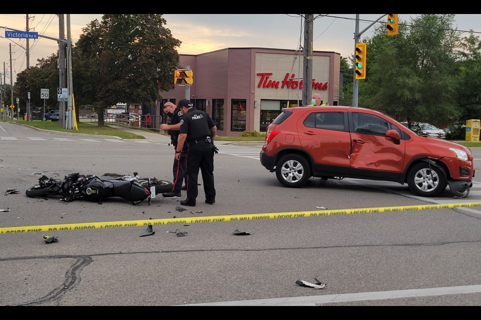 Police investigate after an e-bike and SUV collided at the intersection of Victoria Road and Woodlawn Road Tuesday night.
