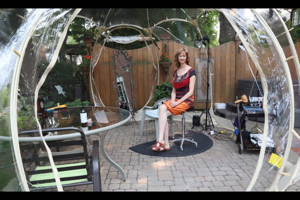 Christie sitting inside the bubble, to illustrate the amount of space it offers. Ariel Deutschmann/GuelphToday