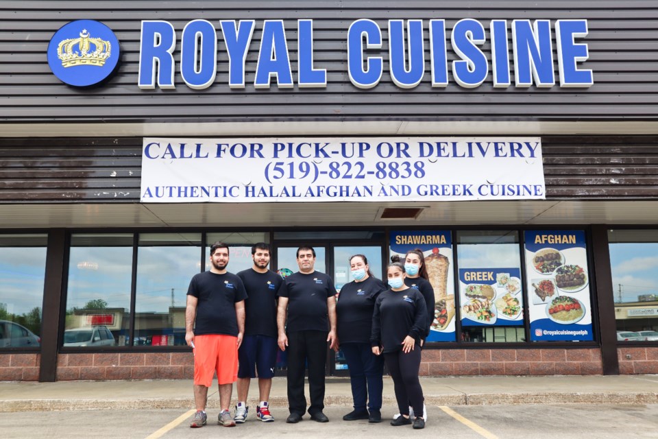 Shafieq Gohozar, left, and family in front of Royal Cuisine restaurant in the Grange Plaza. Ariel Deutschmann/GuelphToday