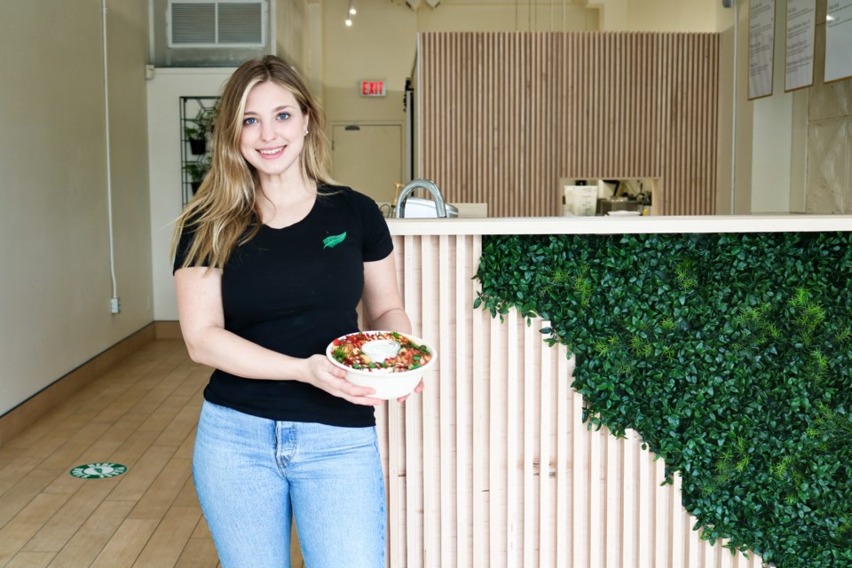 Alexis Imola, the owner of Ivory Fern Foods, posing inside of her business in downtown Guelph.