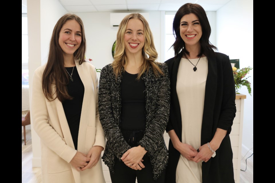 Natalia Rey-Caughlin, left, with Courtney Clayson-Russell and Lindsay Newby.