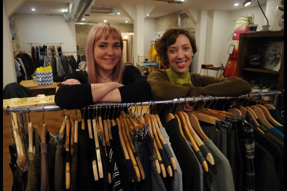Stephanie Traplin, left, and Natalie Boustead have opened Take Time, a vintage clothing store and gallery in the former Macondo Books store on Wilson Street in Downtown Guelph. Tony Saxon/GuelphToday