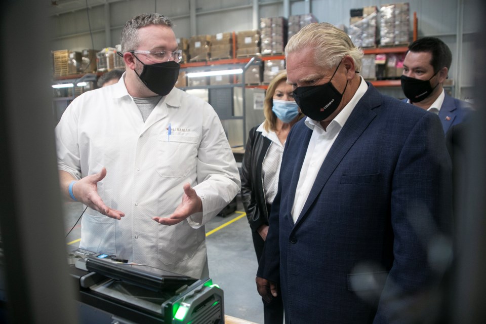 A Linamar employee shows a ventilator in the process of being assembled to premier Doug Ford during a photo op Tuesday at Linamar's iHub. Kenneth Armstrong/GuelphToday
