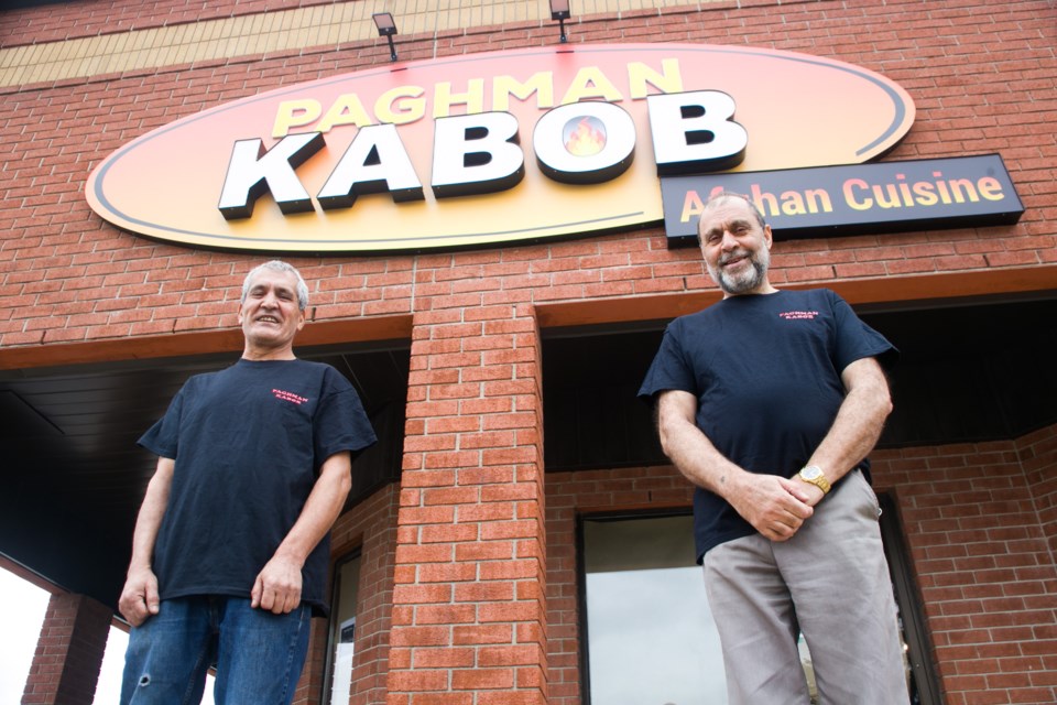 Daud Salimi , left, poses outside Paghman Kabob with Speengul Safi. Kenneth Armstrong, GuelphToday