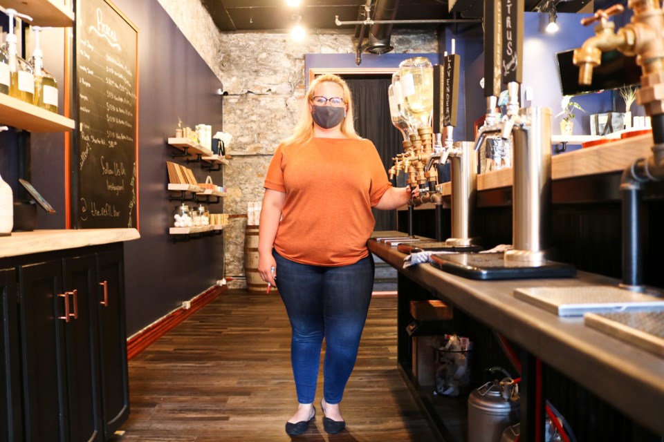 Lindsey Oman stands by taps of product at The Refill Bar. Ariel Deutschmann/GuelphToday