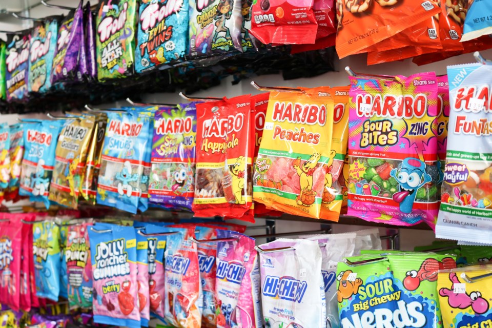 A wall of colourful candy bags at SnaxStop.