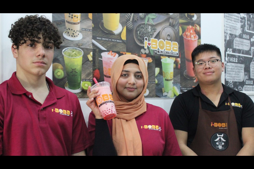 I ❤️ Boba worker George Aldarwish, left, along with managers Filza Shah and Albrt Thang hang out with a cup of boba inside the franchise's new location in Guelph.