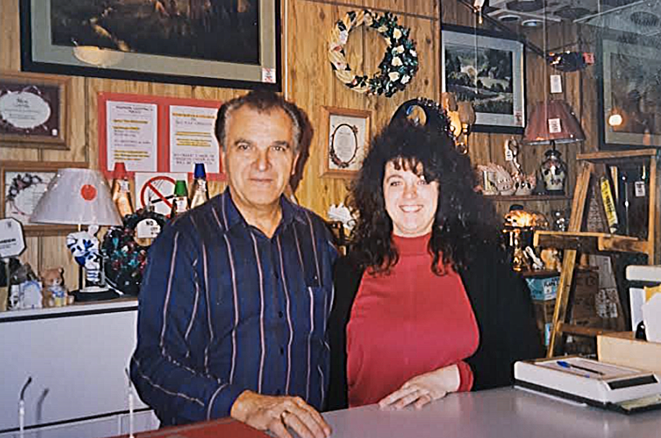 An old photo shows father and daughter Lui and Paula Gatto at Fashion Lighting on Gordon Street in the early 2000s. 