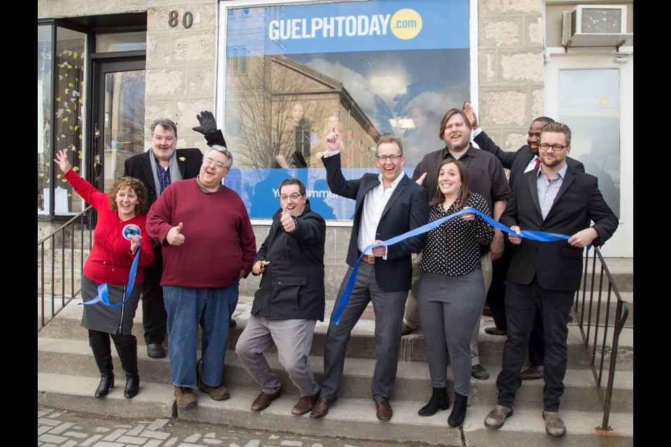 The ribbon is cut for the new GuelphToday office on Norfolk Street on Thursday. Photo by Nicole Parks.