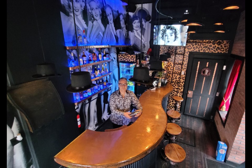 Doug Todd, who operates Standing Room Only, stands behind the bar in the near 144-square-foot space, considered the smallest bar in Canada.