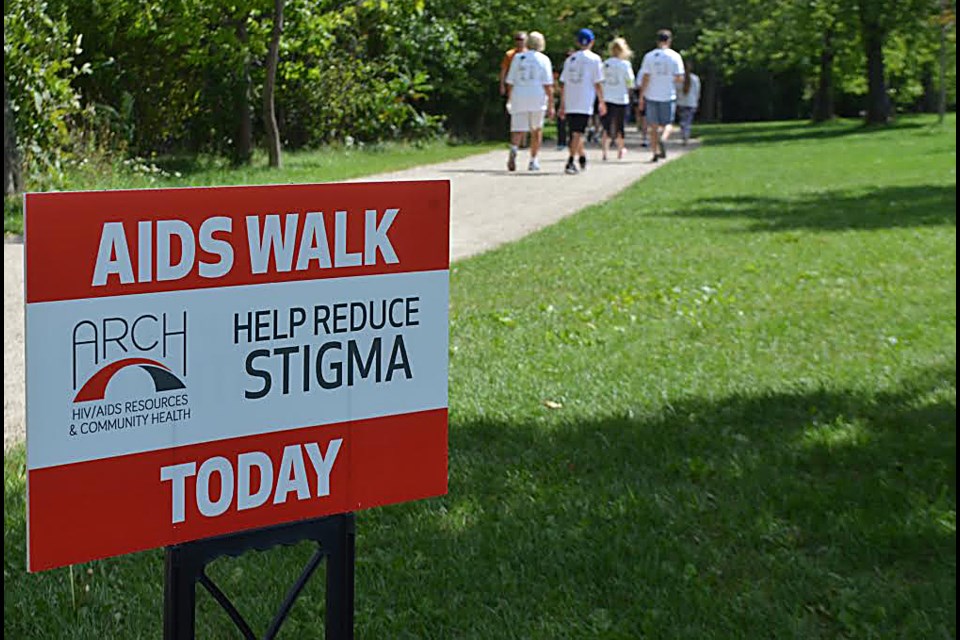 Sign posted on the trail at Riverside Park for the Guelph 2016 AIDS walk organized by ARCH -HIV/AIDS Resources & Community Health. Troy Bridgeman for GuelphToday.