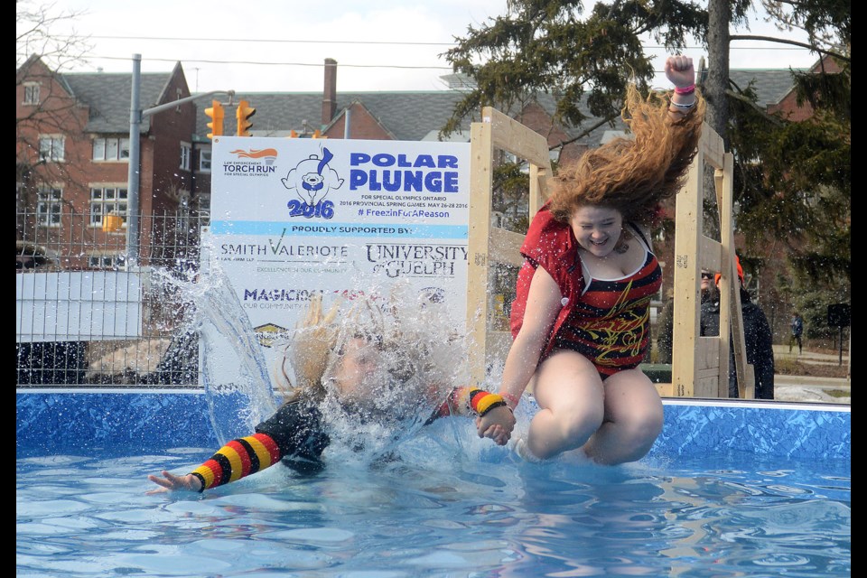 Two University of Guelph Students jump together at the Polar Bear Plunge for Special Olympics held at the University of Guelph Saturday, Feb. 6, 2016. Tony Saxon/GuelphToday