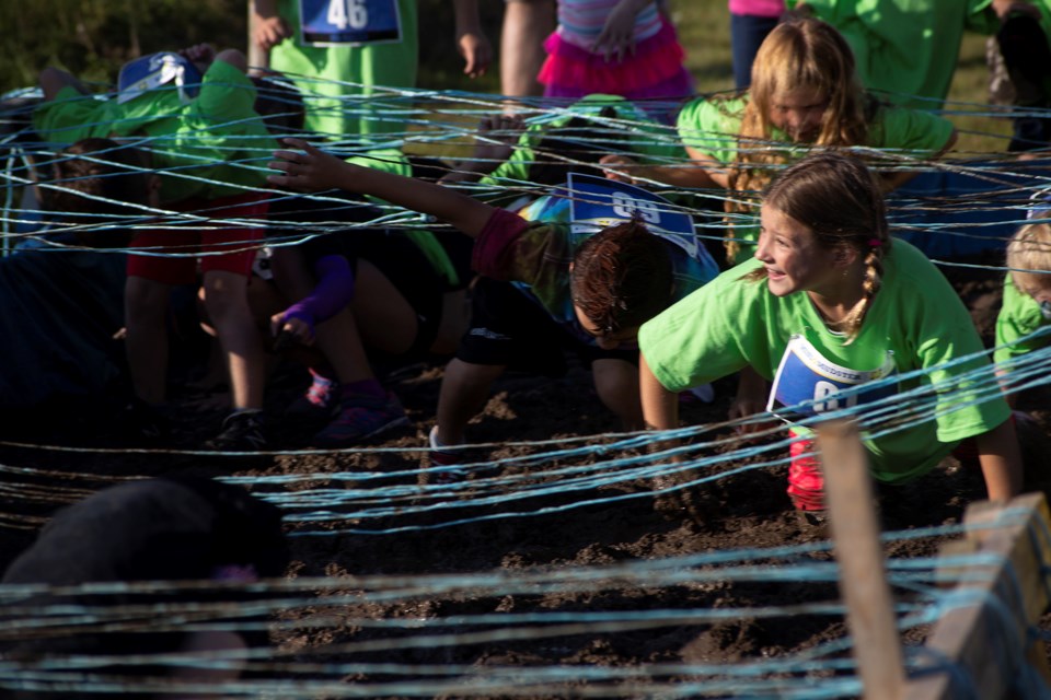 Kids compete in the first ever Mini Mudster, a 1-km mud run and obstacle course held prior to the adult 5-km 2018 Mudmoiselle held Sept. 15 at Cox Creek Cellars. Kenneth Armstrong/GuelphToday