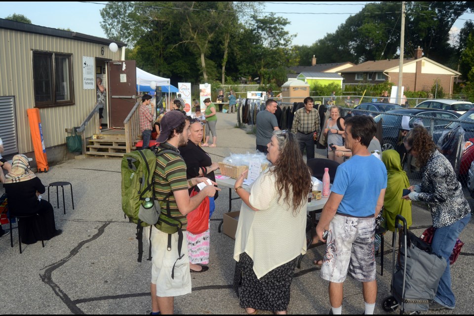 The North End Harvest Market on Waverley Drive had roughly 20 community booths set up on Wednesday, Aug. 17, 2017, to connect with people from the neighbourhood. Tony Saxon/GuelphToday