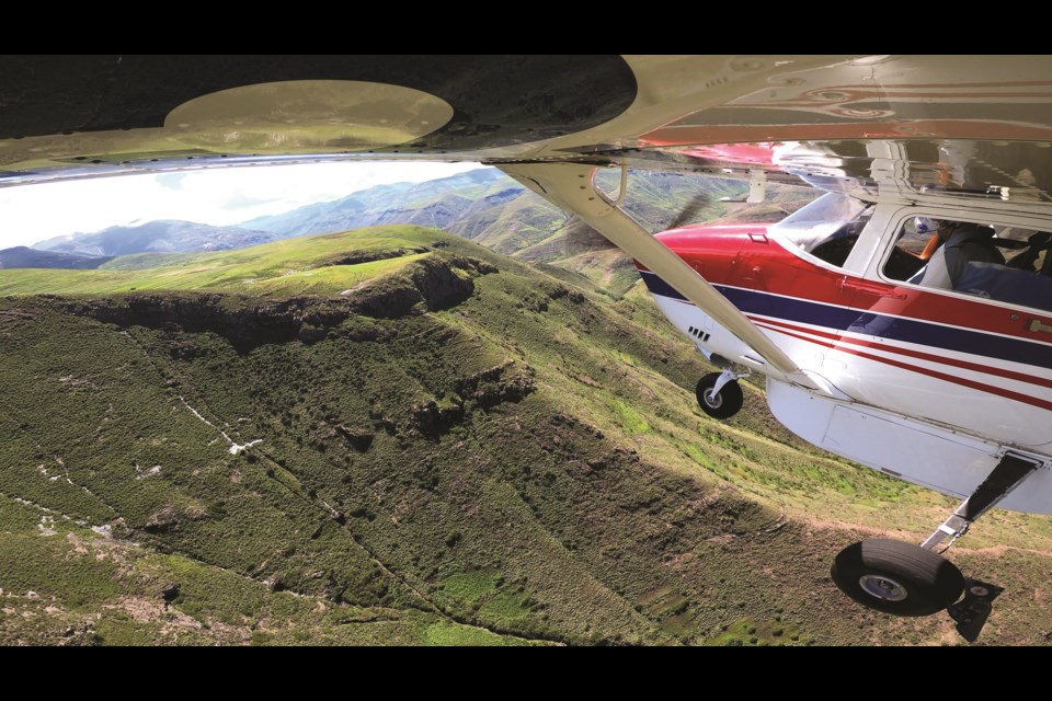 An MAF plane flies over mountains in Lesotho. Photo by Grant Strugnell, MAF Lesotho
