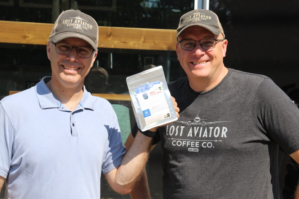 The Lost Aviator Coffee Company owners Steve Zago, left, and Adam Wright stand with the Lantern Brew, a unique coffee blend sold in support of the Guelph Black Heritage Society.