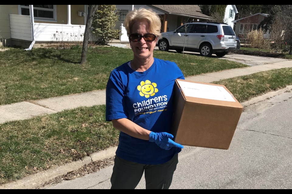 Volunteer Cindy delivering food. Photo provided by Children’s Foundation of Guelph and Wellington