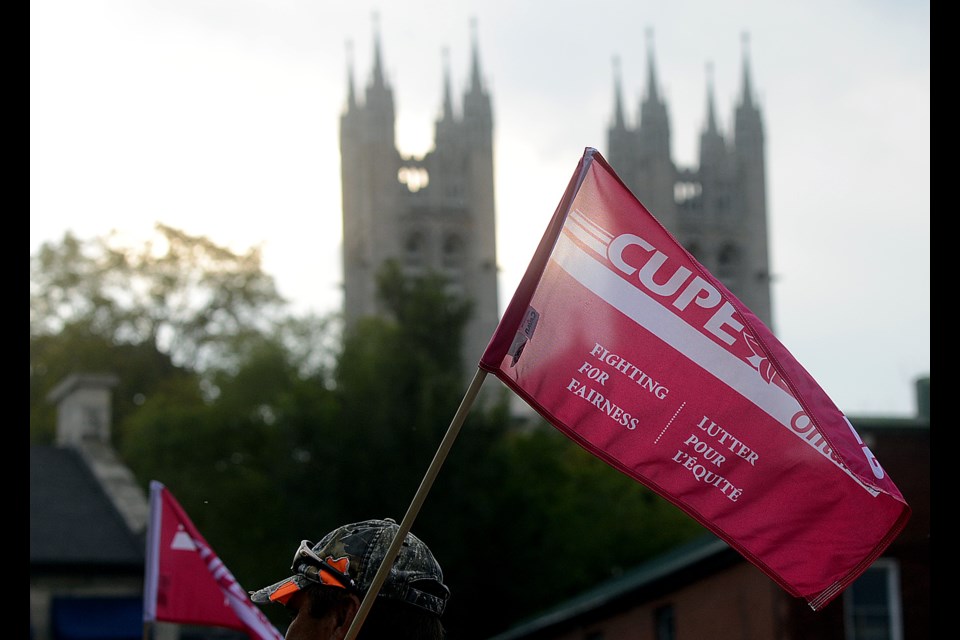 CUPE Local 241 rallied outside Guelph City Hall Monday, Sept. 18, 2017. The union fears the city is looking at privatizing waste resources in the city. Tony Saxon/GuelphToday.com