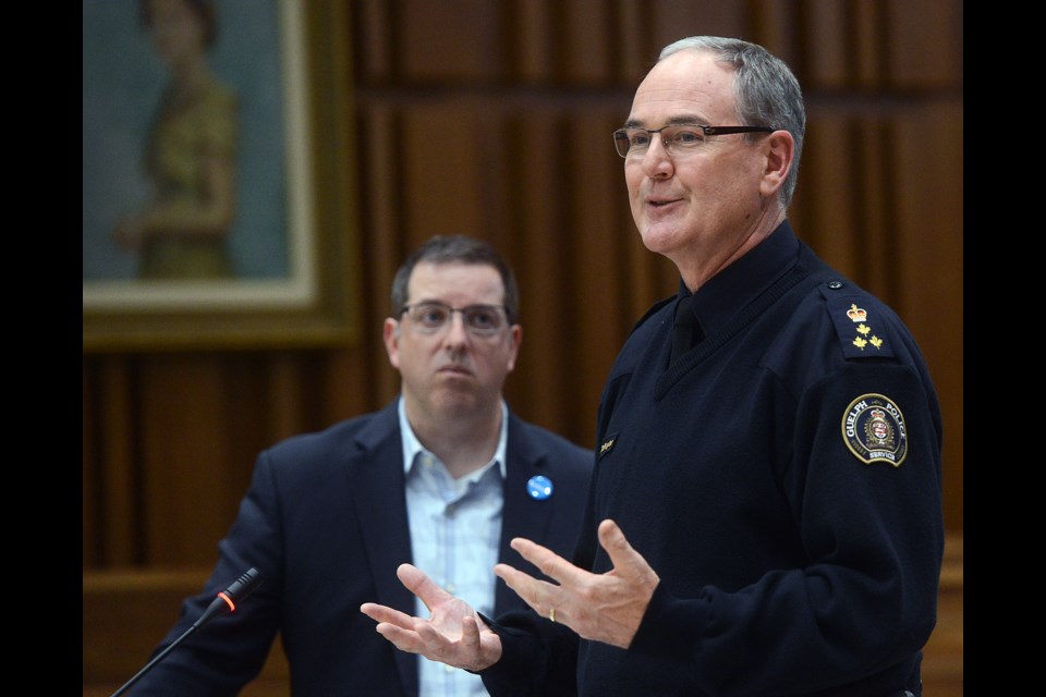 Guelph Police Chief Jeff DeRuyter speaks at the Mayor's Forum On Substance Use as Mayor Cam Guthrie looks on Monday, Oct. 16, 2017, at Guelph City Hall. Tony Saxon/GuelphToday