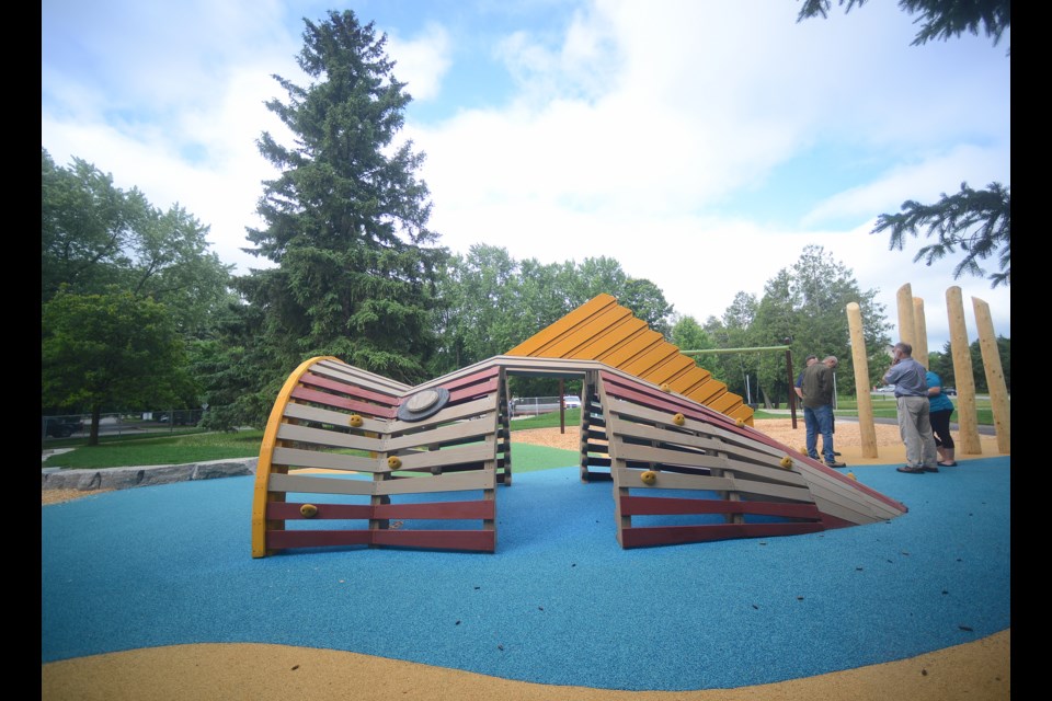 A fishy play structure surrounded by rubberized ground cover is one of the highlights of the new Riverside Park playground. Tony Saxon/GuelphToday