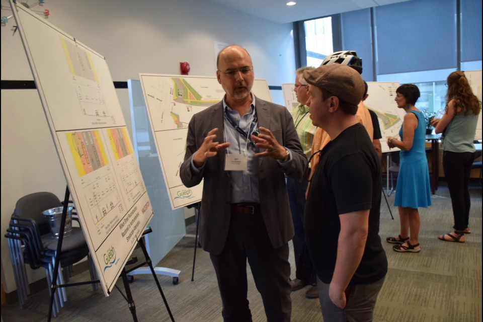 Ian Panabaker, left, Guelph's general manager of downtown renewal, explains the finer points of the Wilson Street reconstruction to Jared Ferrall, a downtown business owner. 