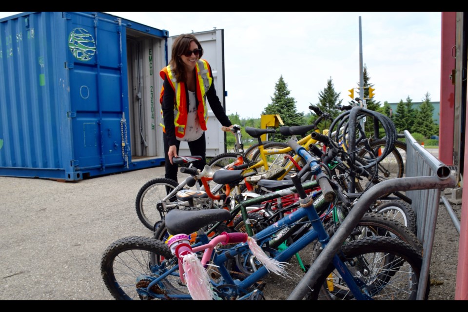 Shelley Lorenz, waste policy analyst, says the Waste Resource Innovation Centre gives away about 350 bikes each year. 