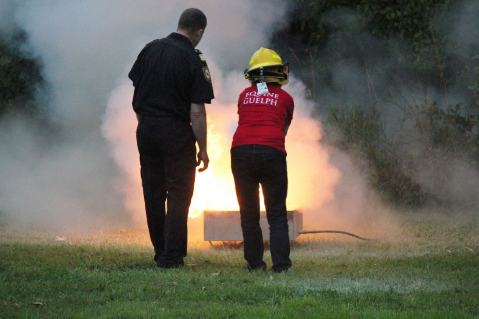 Participants practice fire extinguishing techniques last fall at Equine Guelph's technical large animal emergency rescue training. Photo by Toni Macpherson.