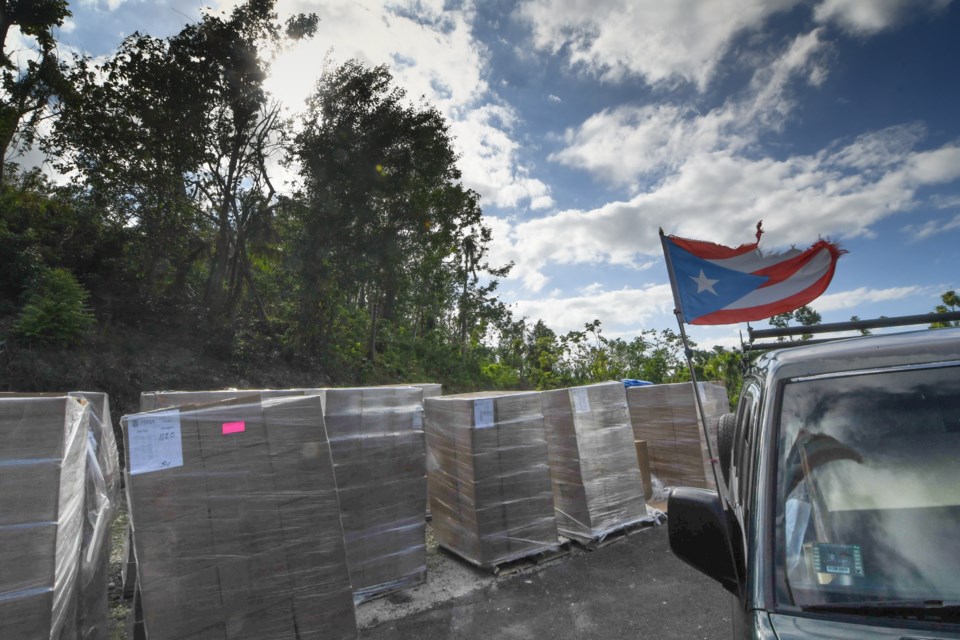 Food arrives at an emergency food distribution in the mountains of Puerto Rico. Photo: Philip Maher