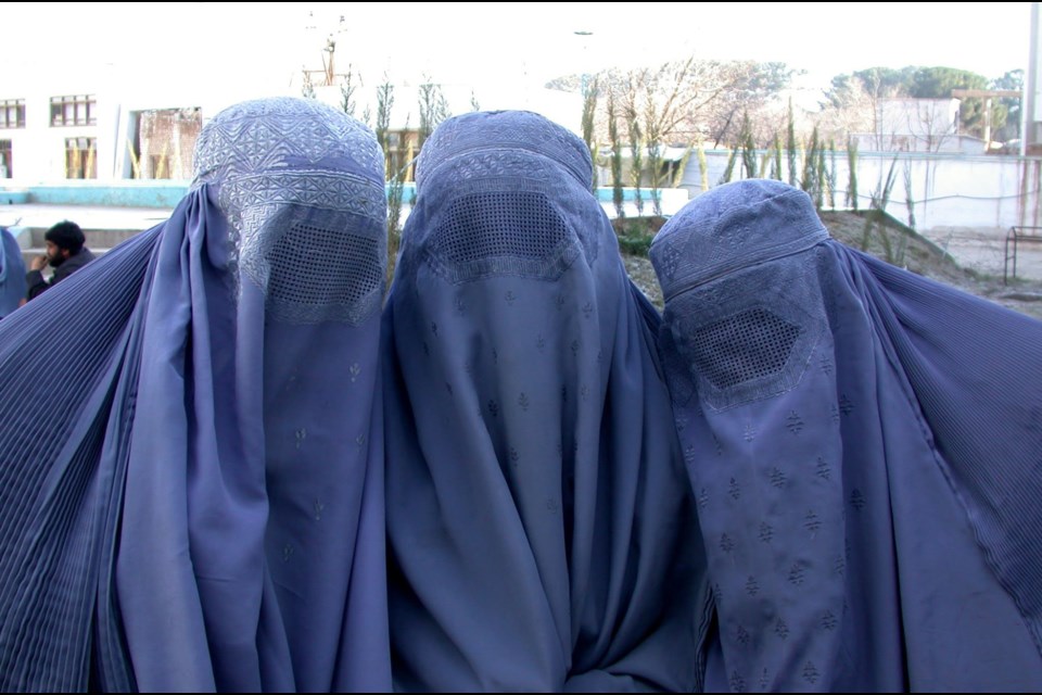  Afghani’s were eager to talk to foreigners. These three ladies became friends. You got used to identifying people by their voice not their face. In the office women would show their face but on the street they tended to continue the tradition of the bourka.