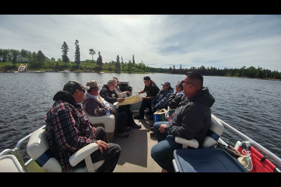 During the reconnaissance stage of their study, researchers participated in a day-long boat tour of the Winnipeg River. The youth and knowledge keepers pictured here selected the research sites. Photo courtesy Brittany Luby